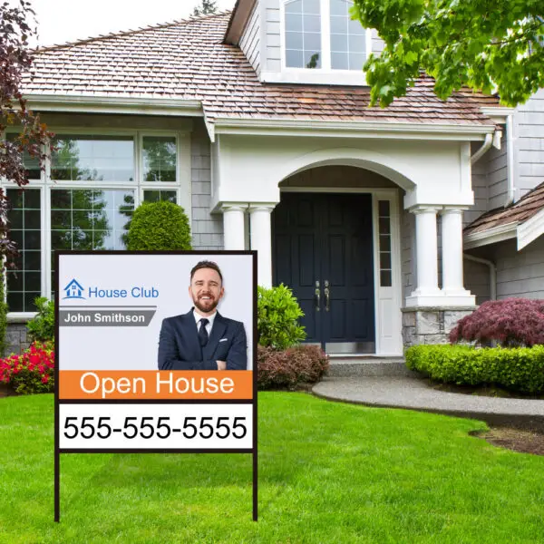 Real Estate Frame and Sign shown in front yard.