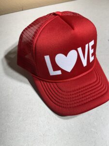 Red foam trucker hat shown here