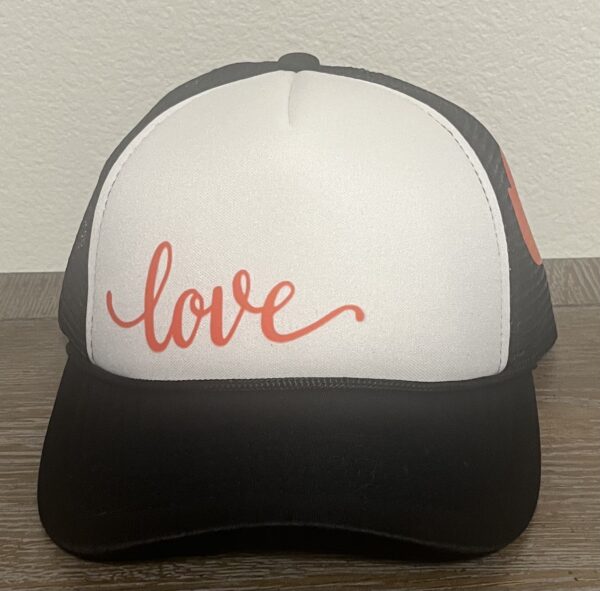 Love trucker hat black hat with white face